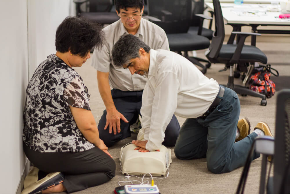 The Staff performing CPR with a Defibrillator