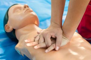 CPR training - Chest compressions performed on a CPR dummy